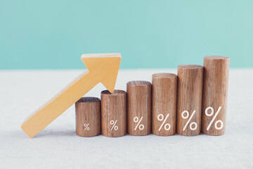 Building blocks with % signs on them and an arrow going up.