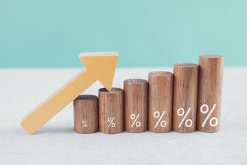 Building blocks with % signs on them and an arrow going up.